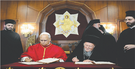 Pope Leo XIV and Ecumenical Patriarch Bartholomew I signing a joint declaration against religious violence.