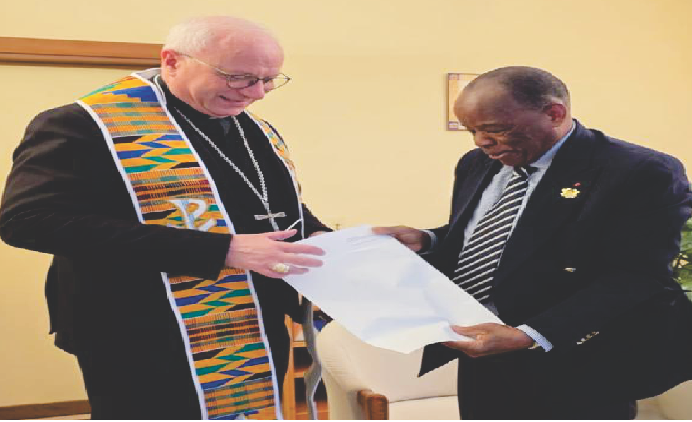 Sir Assorow presenting the request to Archbishop Baturi (wearing the stole) the Ambassador presented to him
